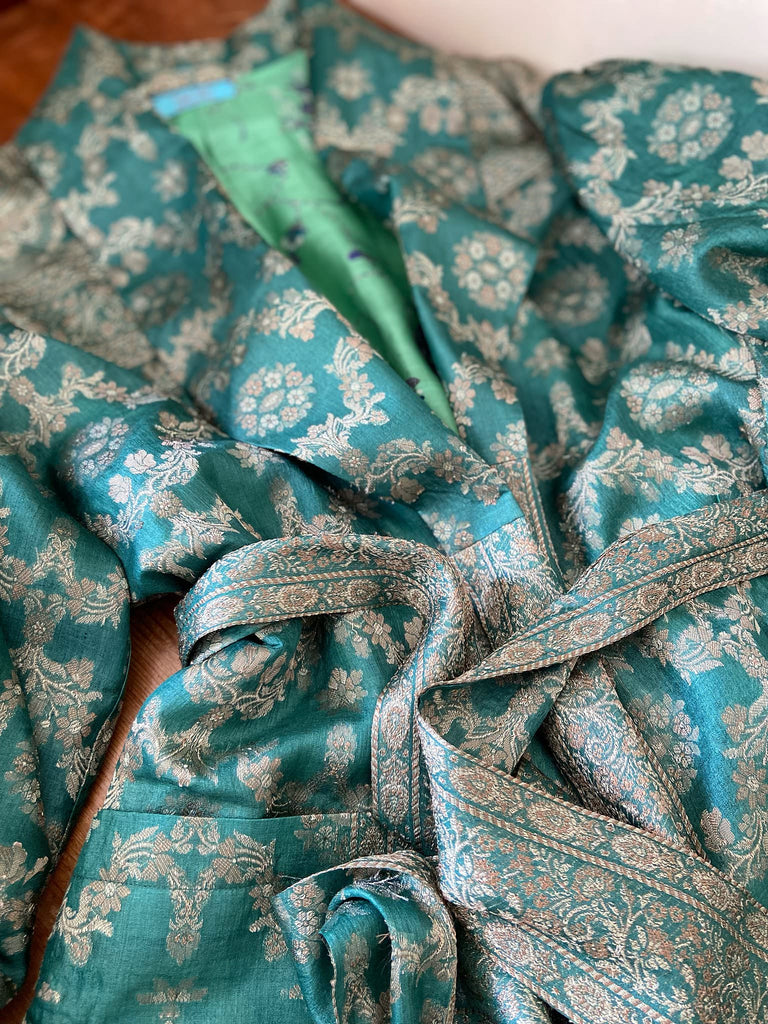 Jade green lightweight silk wrapper robe with full sleeves, large patch pockets and tassel sash. Bohemian style sustainably created from antique and vintage textiles by the Pavilion Parade studio.