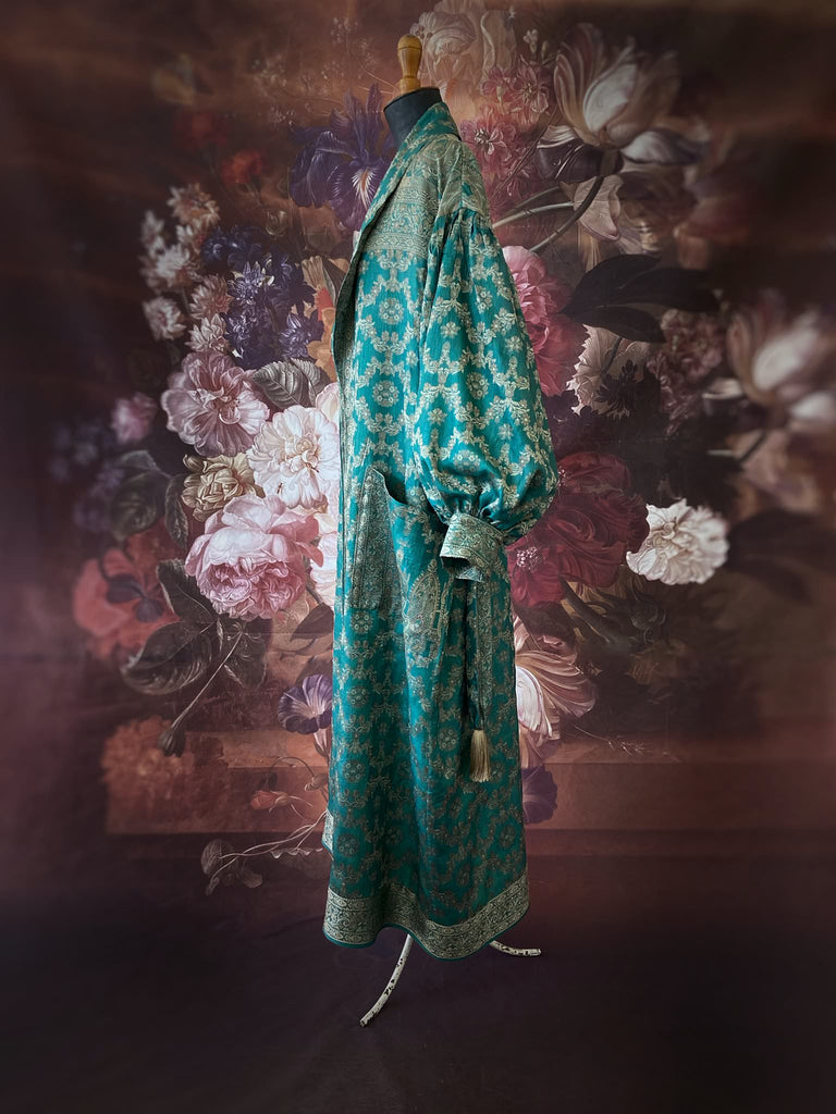Jade green lightweight silk wrapper robe with full sleeves, large patch pockets and tassel sash. Bohemian style sustainably created from antique and vintage textiles by the Pavilion Parade studio.