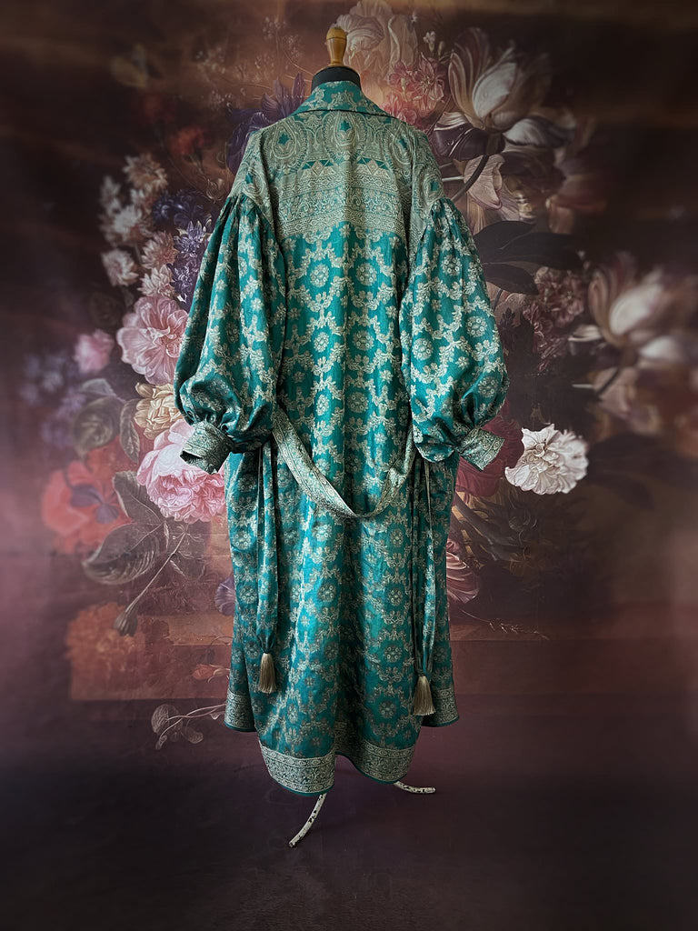 Jade green lightweight silk wrapper robe with full sleeves, large patch pockets and tassel sash. Bohemian style sustainably created from antique and vintage textiles by the Pavilion Parade studio.