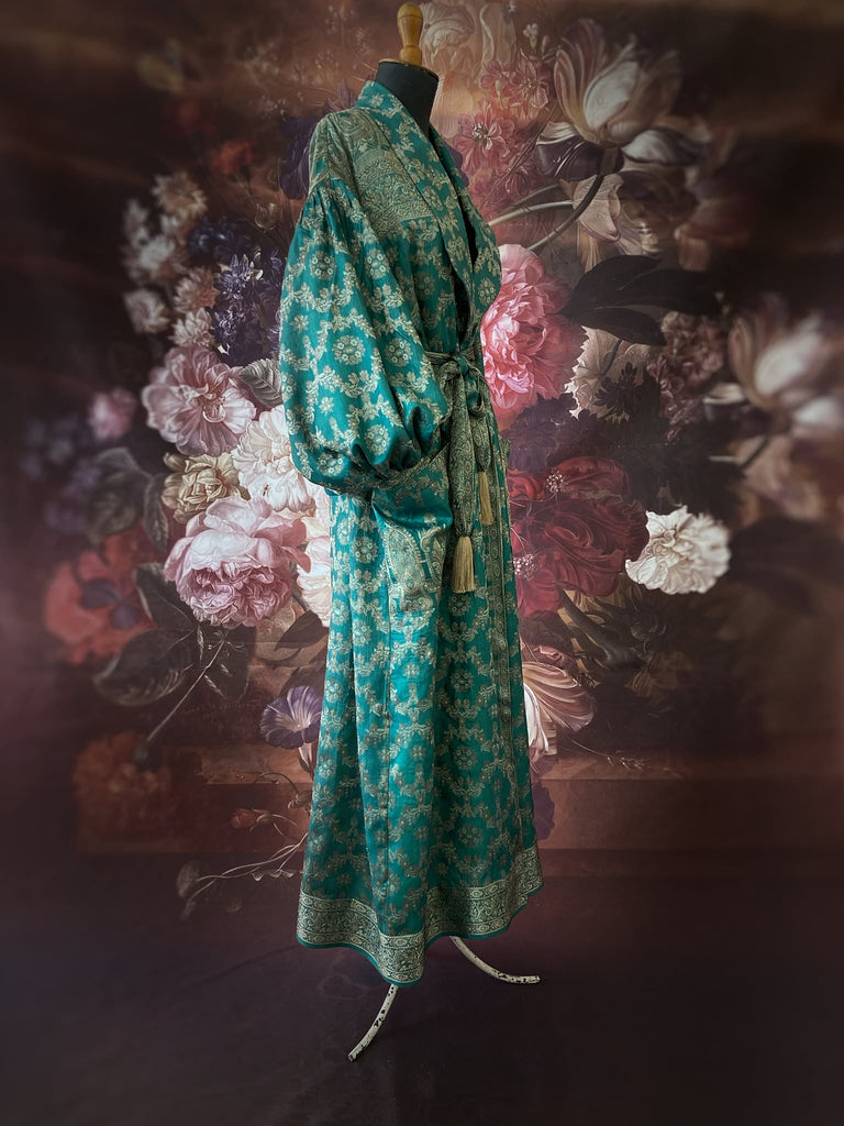 Jade green lightweight silk wrapper robe with full sleeves, large patch pockets and tassel sash. Bohemian style sustainably created from antique and vintage textiles by the Pavilion Parade studio.