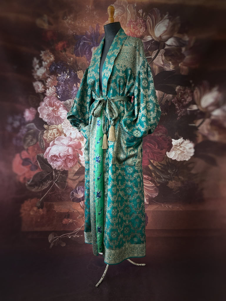 Jade green lightweight silk wrapper robe with full sleeves, large patch pockets and tassel sash. Bohemian style sustainably created from antique and vintage textiles by the Pavilion Parade studio.