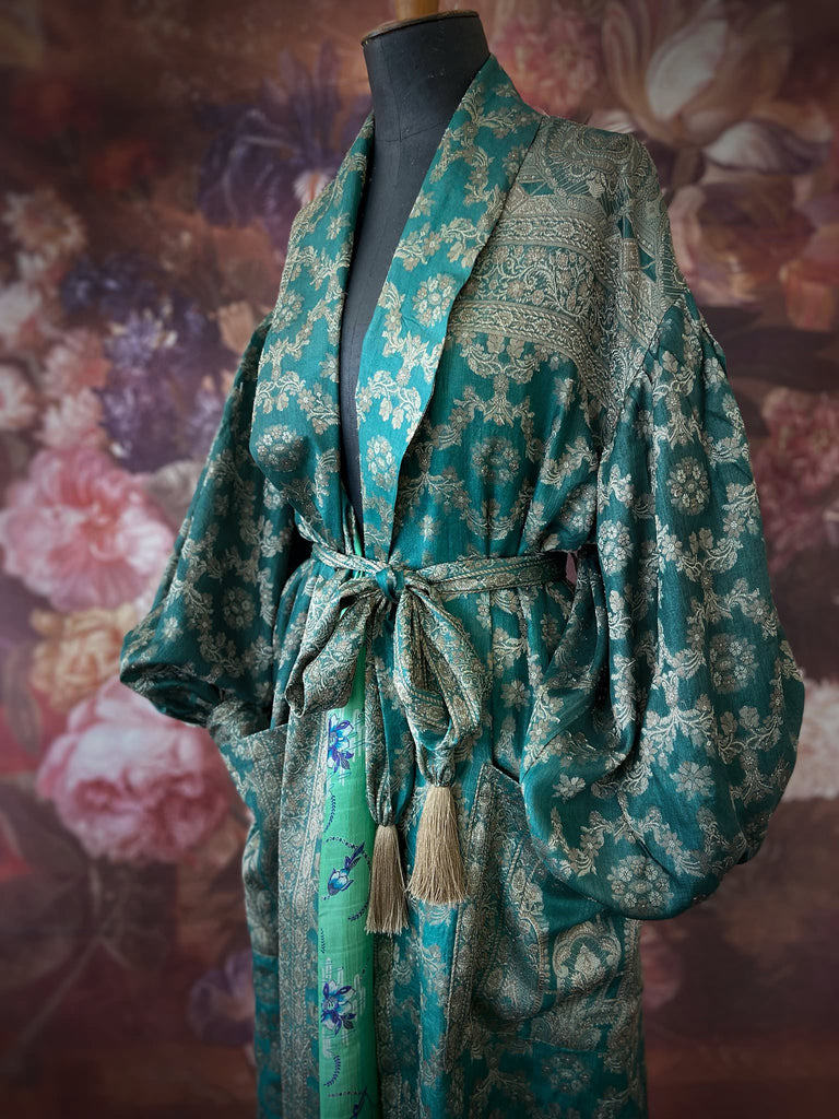 Jade green lightweight silk wrapper robe with full sleeves, large patch pockets and tassel sash. Bohemian style sustainably created from antique and vintage textiles by the Pavilion Parade studio.