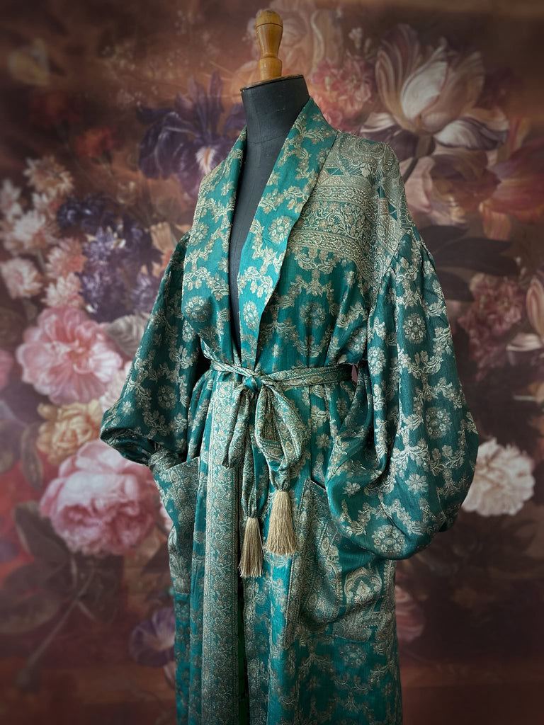 Jade green lightweight silk wrapper robe with full sleeves, large patch pockets and tassel sash. Bohemian style sustainably created from antique and vintage textiles by the Pavilion Parade studio.