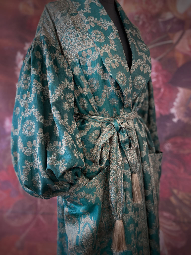 Jade green lightweight silk wrapper robe with full sleeves, large patch pockets and tassel sash. Bohemian style sustainably created from antique and vintage textiles by the Pavilion Parade studio.