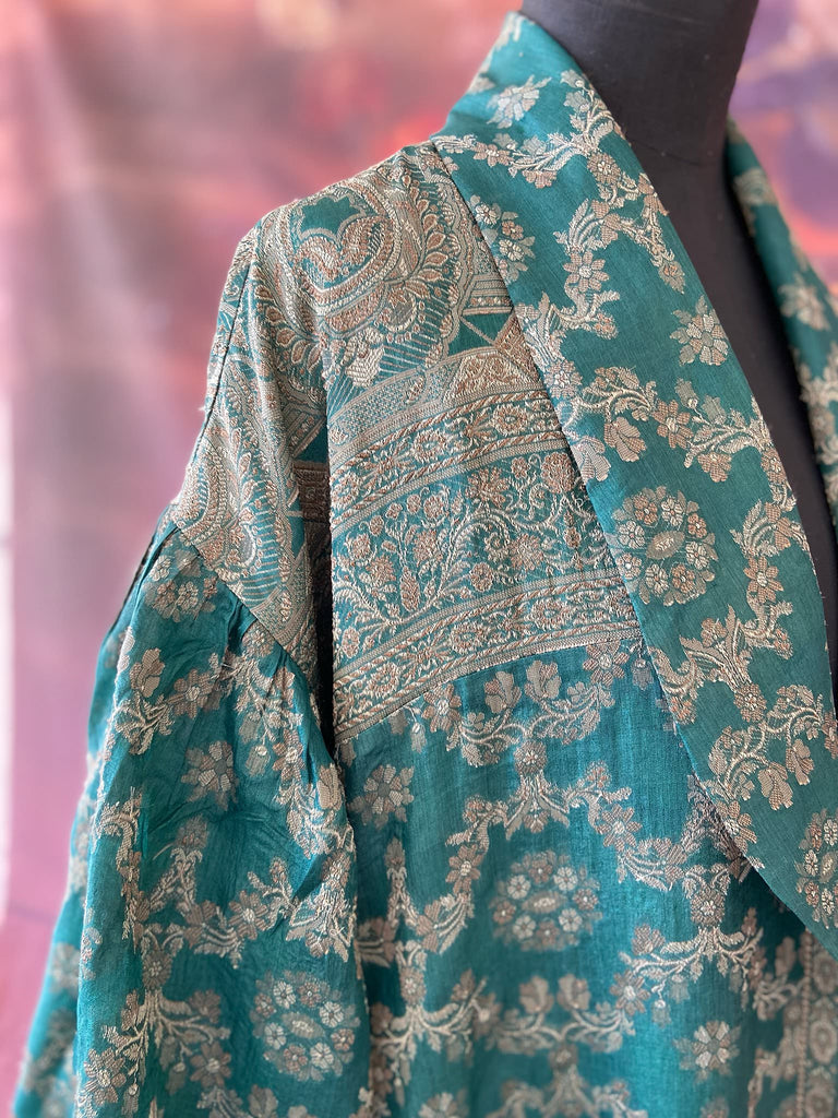 Jade green lightweight silk wrapper robe with full sleeves, large patch pockets and tassel sash. Bohemian style sustainably created from antique and vintage textiles by the Pavilion Parade studio.