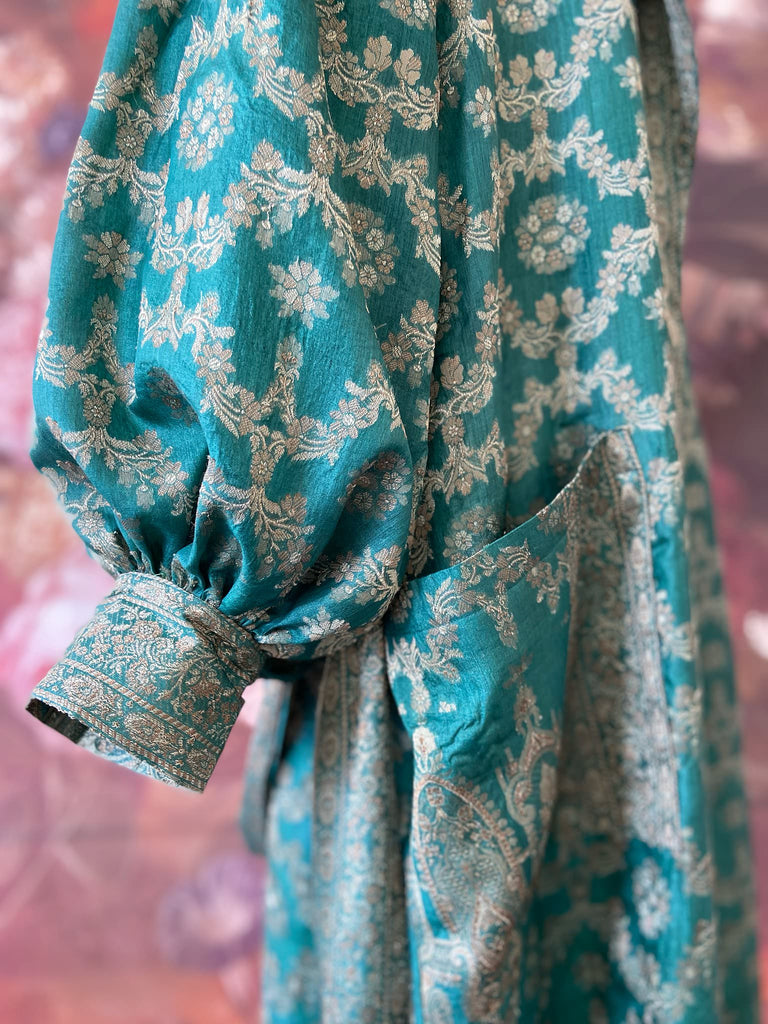 Jade green lightweight silk wrapper robe with full sleeves, large patch pockets and tassel sash. Bohemian style sustainably created from antique and vintage textiles by the Pavilion Parade studio.
