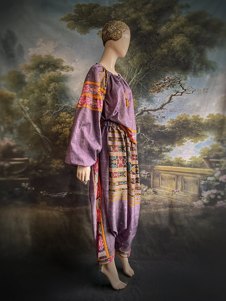 Lavender, mustard yellow, and teal fine cotton Ikat beach pyjamas with full sleeved drawstring neckline blouse and drawstring Ottoman harem pants. Bohemian styles created from  vintage and antique textiles by the Pavilion Parade studio