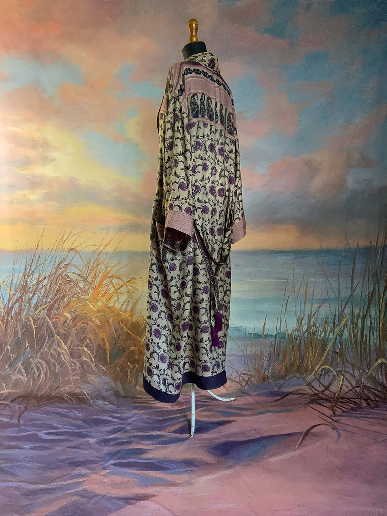 Pale lavender and lilac fine wool robe with silk lining. Wide sleeves, pockets , and tassel sash. Sustainably created from antique and vintage textiles by the Pavilion Parade studio