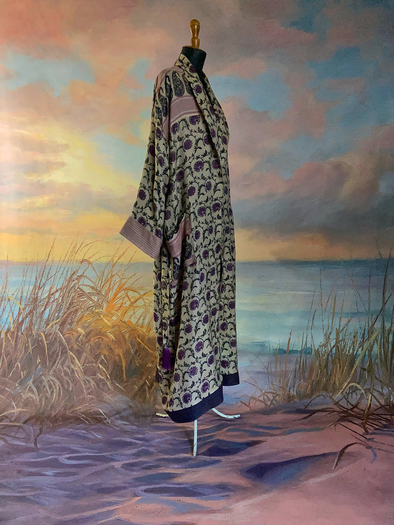 Pale lavender and lilac fine wool robe with silk lining. Wide sleeves, pockets , and tassel sash. Sustainably created from antique and vintage textiles by the Pavilion Parade studio