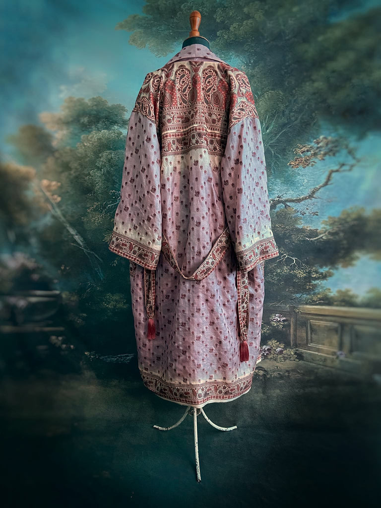 Pale lavender, ivory, and burnt orange silk robe with wide sleeves, tassel sash, and deep pockets. Unique bohemian styles sustainably created from vintage textiles by the Pavilion Parade studio.