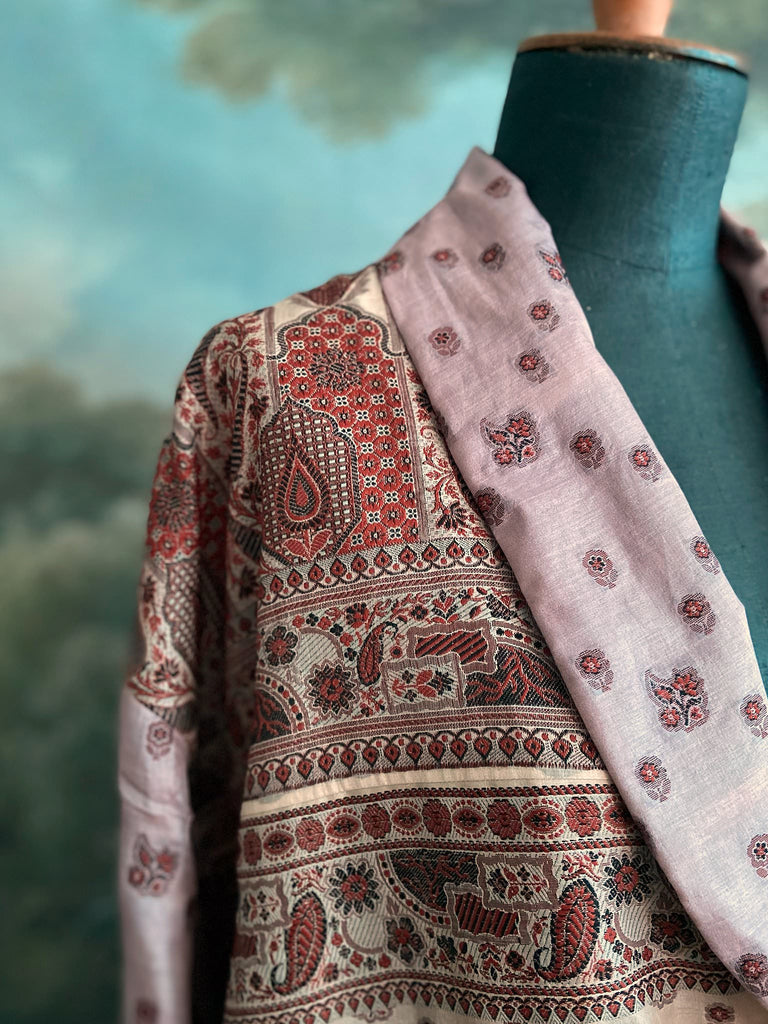 Pale lavender, ivory, and burnt orange silk robe with wide sleeves, tassel sash, and deep pockets. Unique bohemian styles sustainably created from vintage textiles by the Pavilion Parade studio.