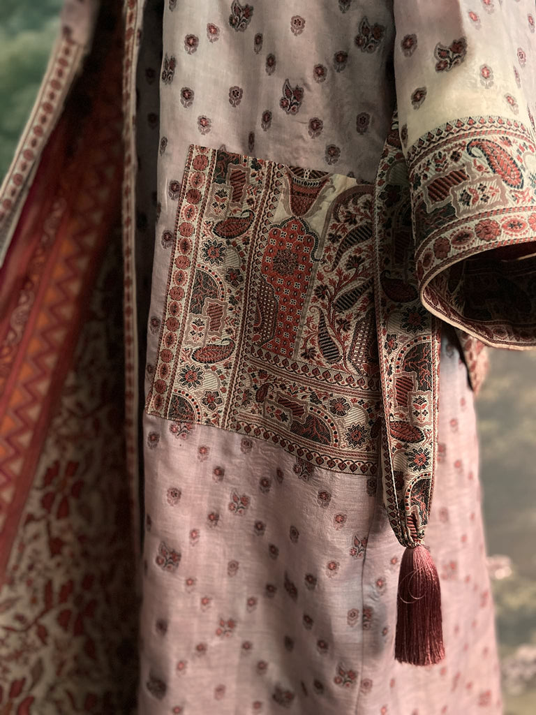 Pale lavender, ivory, and burnt orange silk robe with wide sleeves, tassel sash, and deep pockets. Unique bohemian styles sustainably created from vintage textiles by the Pavilion Parade studio.