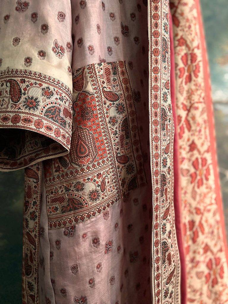 Pale lavender, ivory, and burnt orange silk robe with wide sleeves, tassel sash, and deep pockets. Unique bohemian styles sustainably created from vintage textiles by the Pavilion Parade studio.