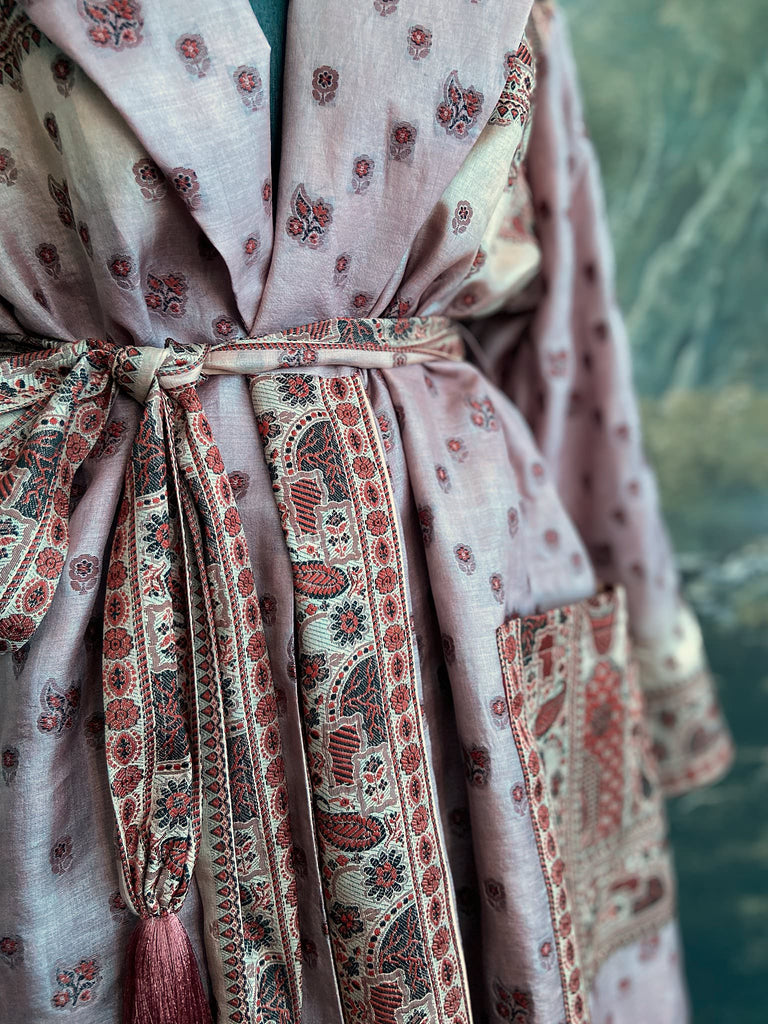 Pale lavender, ivory, and burnt orange silk robe with wide sleeves, tassel sash, and deep pockets. Unique bohemian styles sustainably created from vintage textiles by the Pavilion Parade studio.