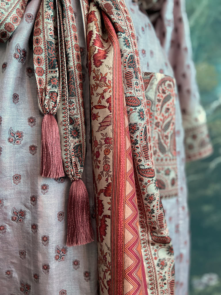 Pale lavender, ivory, and burnt orange silk robe with wide sleeves, tassel sash, and deep pockets. Unique bohemian styles sustainably created from vintage textiles by the Pavilion Parade studio.