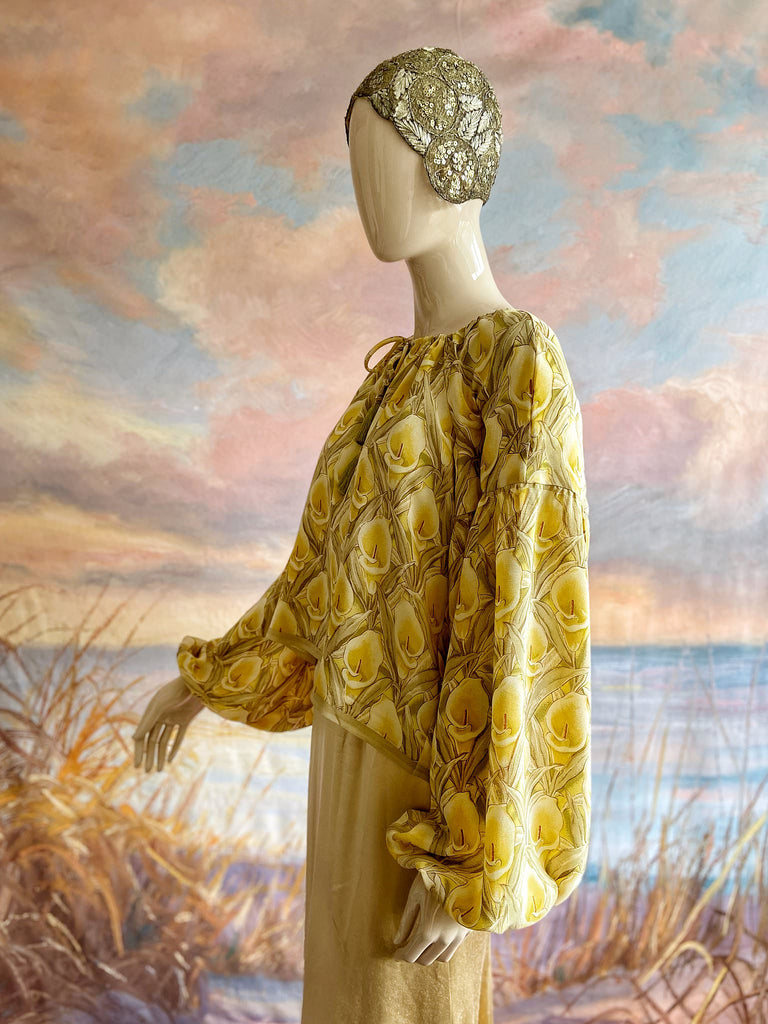 Lemon yellow and sage green silk crepe Calla lily printed blouse with long full sleeves and adjustable drawstring neckline. Bohemian styles sustainably created from antique and vintage textiles by the Pavilion Parade studio. 