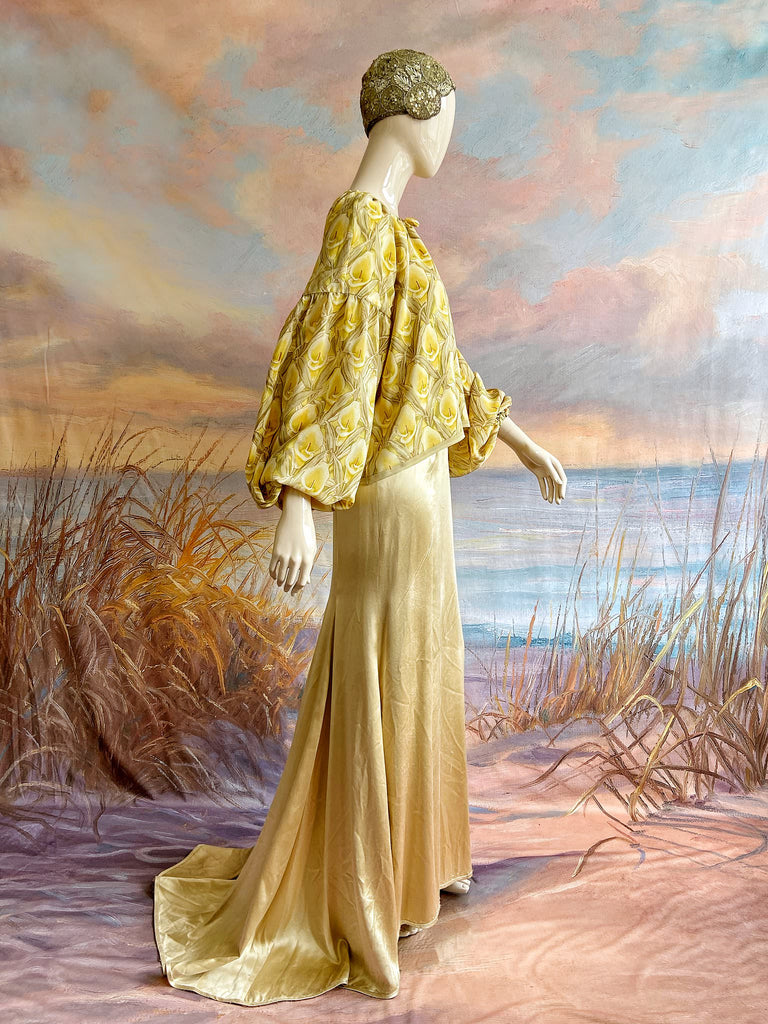 Lemon yellow and sage green silk crepe Calla lily printed blouse with long full sleeves and adjustable drawstring neckline. Bohemian styles sustainably created from antique and vintage textiles by the Pavilion Parade studio. 