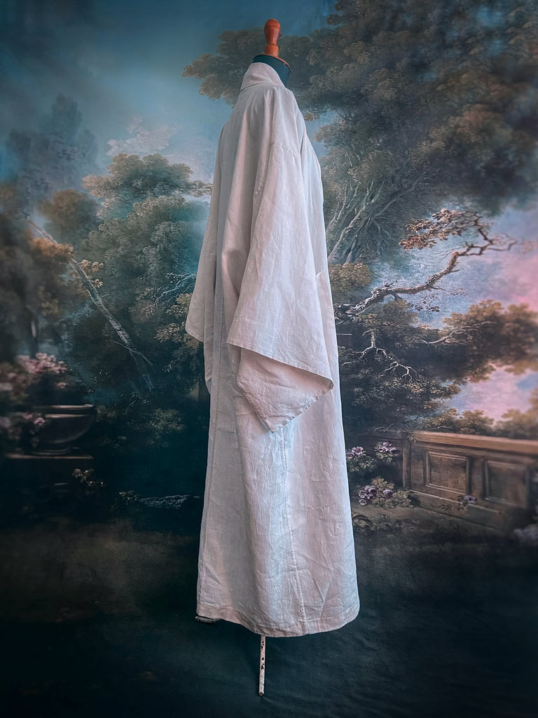 Full length kimono inspired robe with large patch pockets. Newly created from a bolt of deadstock early 20th century antique French flax linen. All French seamed with hand finished hems and collar. Bohemian styles sustainably created from antique and vintage textiles by the Pavilion Parade studio.
