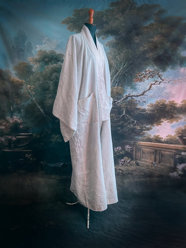 Full length kimono inspired robe with large patch pockets. Newly created from a bolt of deadstock early 20th century antique French flax linen. All French seamed with hand finished hems and collar. Bohemian styles sustainably created from antique and vintage textiles by the Pavilion Parade studio.