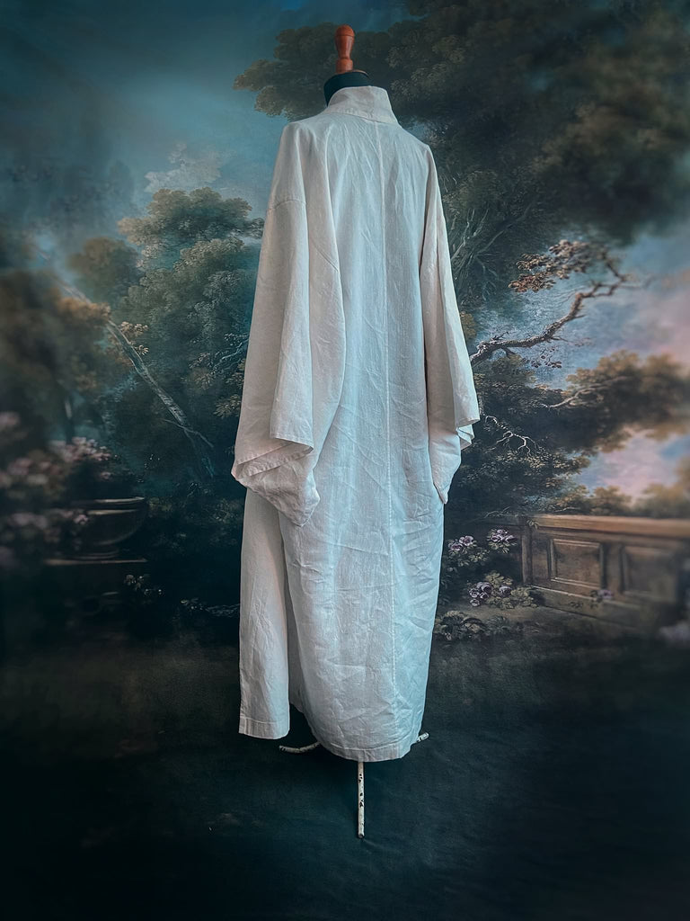Full length kimono inspired robe with large patch pockets. Newly created from a bolt of deadstock early 20th century antique French flax linen. All French seamed with hand finished hems and collar. Bohemian styles sustainably created from antique and vintage textiles by the Pavilion Parade studio.