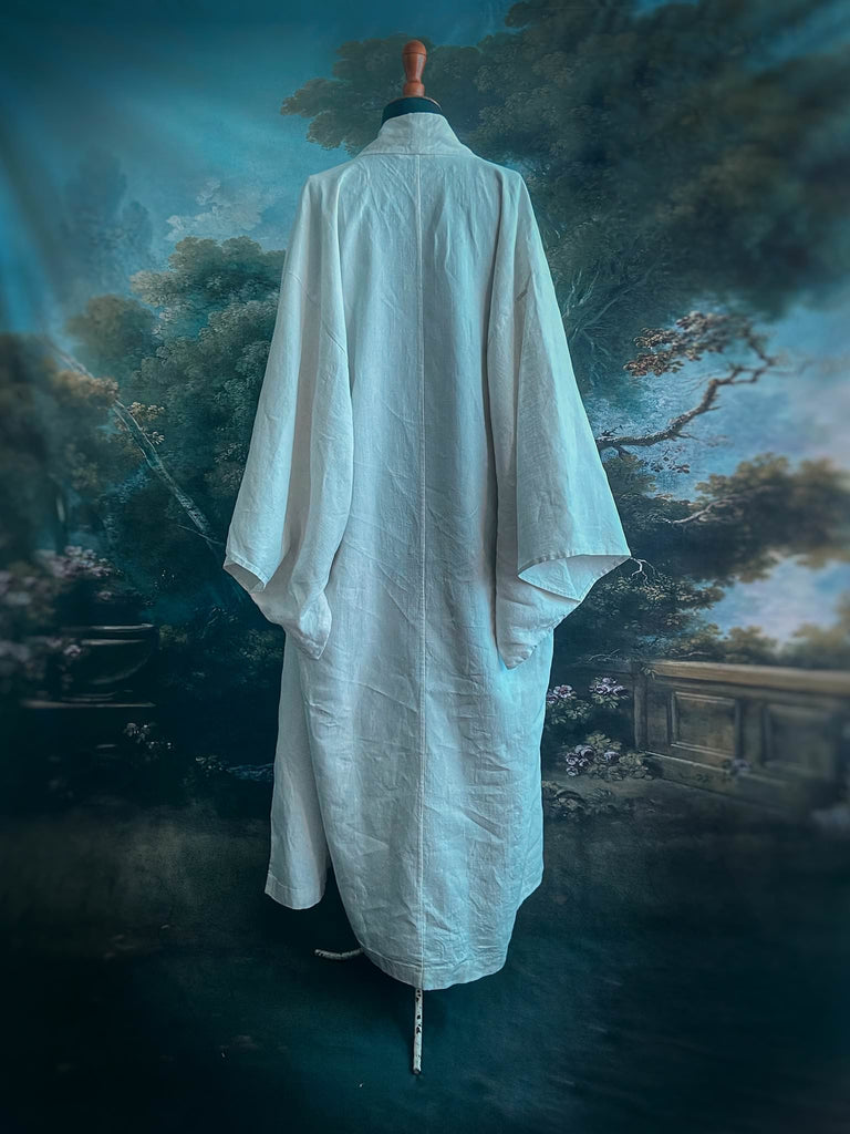 Full length kimono inspired robe with large patch pockets. Newly created from a bolt of deadstock early 20th century antique French flax linen. All French seamed with hand finished hems and collar. Bohemian styles sustainably created from antique and vintage textiles by the Pavilion Parade studio.