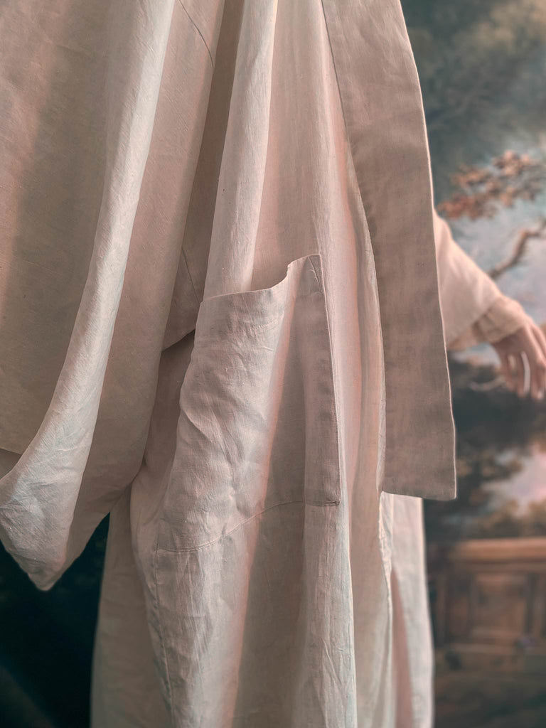 Full length kimono inspired robe with large patch pockets. Newly created from a bolt of deadstock early 20th century antique French flax linen. All French seamed with hand finished hems and collar. Bohemian styles sustainably created from antique and vintage textiles by the Pavilion Parade studio.