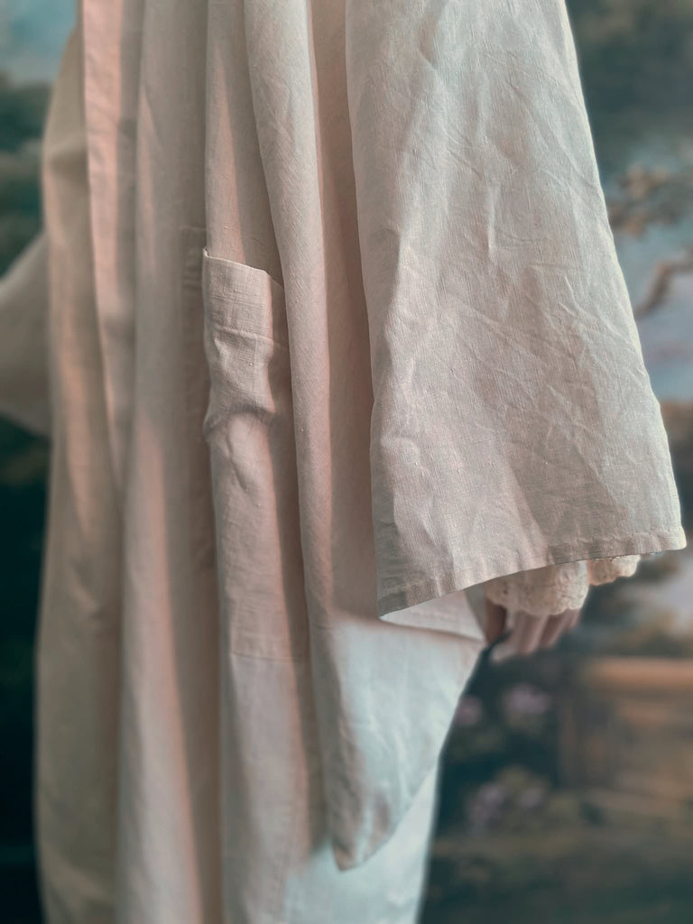 Full length kimono inspired robe with large patch pockets. Newly created from a bolt of deadstock early 20th century antique French flax linen. All French seamed with hand finished hems and collar. Bohemian styles sustainably created from antique and vintage textiles by the Pavilion Parade studio.