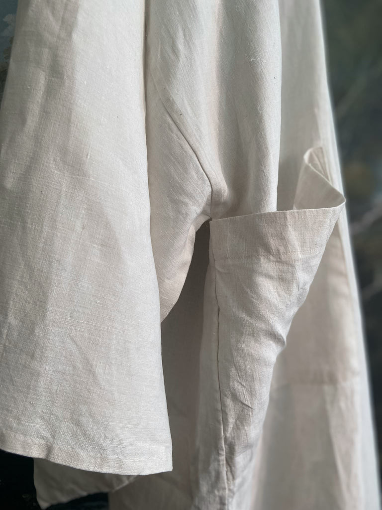 Full length kimono inspired robe with large patch pockets. Newly created from a bolt of deadstock early 20th century antique French flax linen. All French seamed with hand finished hems and collar. Bohemian styles sustainably created from antique and vintage textiles by the Pavilion Parade studio.