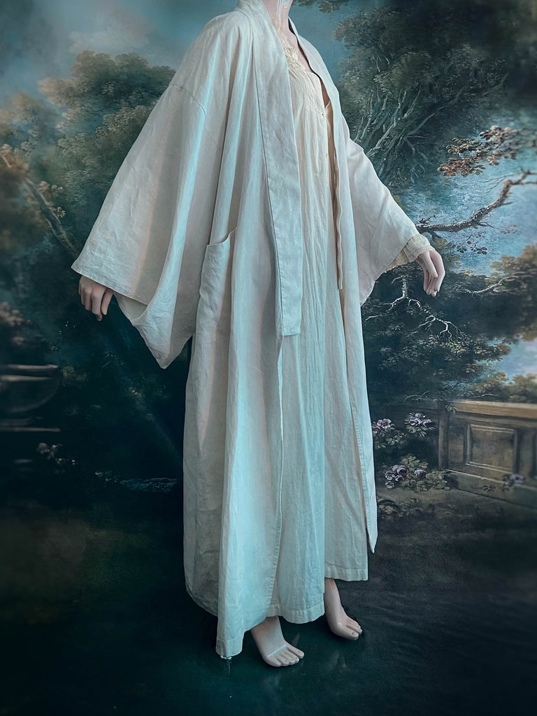 Full length kimono inspired robe with large patch pockets. Newly created from a bolt of deadstock early 20th century antique French flax linen. All French seamed with hand finished hems and collar. Bohemian styles sustainably created from antique and vintage textiles by the Pavilion Parade studio.