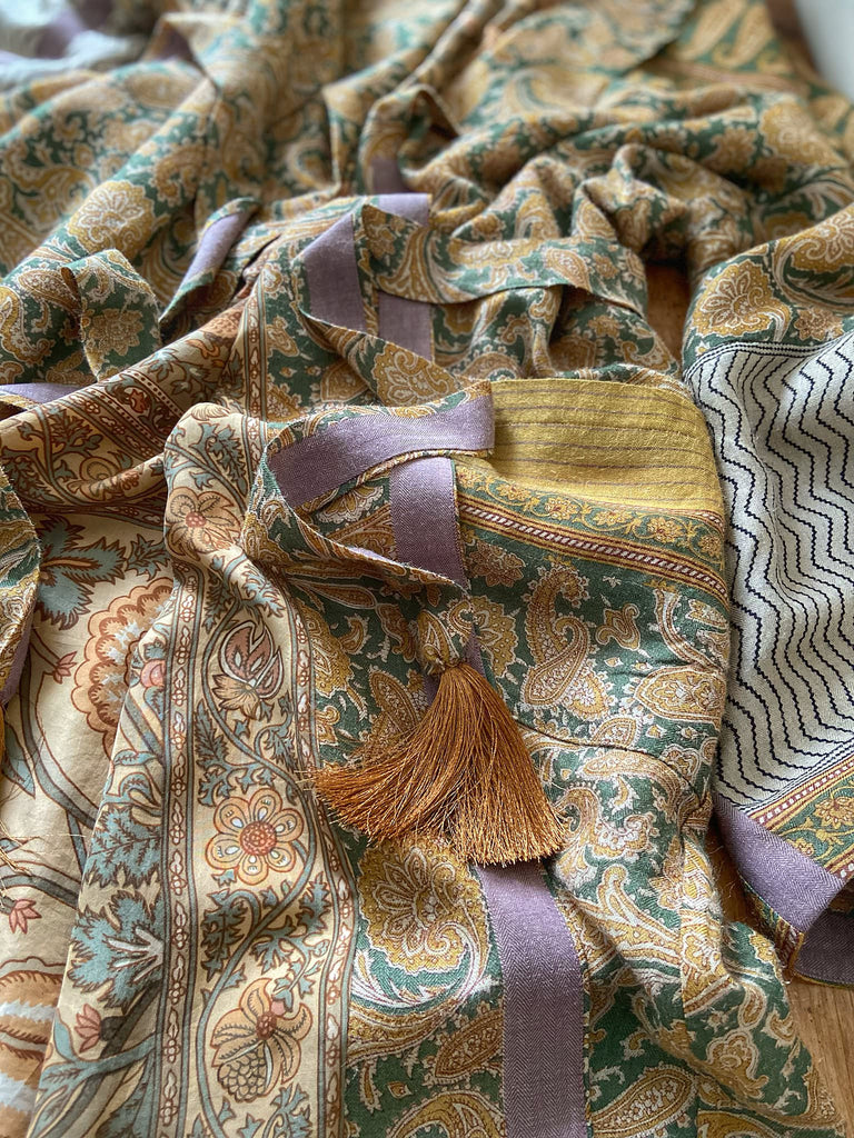 Mustard yellow and moss green paisley block print fine wool dressing robe with wide sleeves, patch pockets and tassel tie sash. Bohemian styles created from antique and vintage textiles by the Pavilion Parade Studio