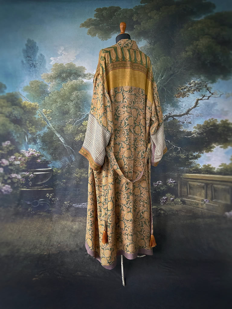 Mustard yellow and moss green paisley block print fine wool dressing robe with wide sleeves, patch pockets and tassel tie sash. Bohemian styles created from antique and vintage textiles by the Pavilion Parade Studio