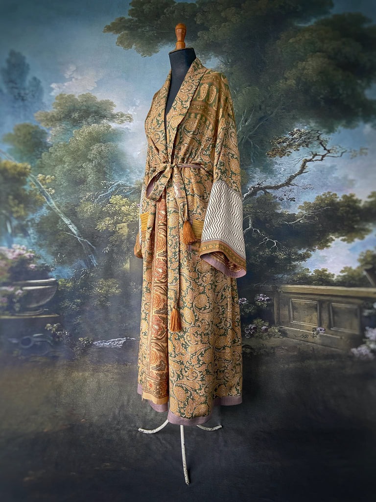 Mustard yellow and moss green paisley block print fine wool dressing robe with wide sleeves, patch pockets and tassel tie sash. Bohemian styles created from antique and vintage textiles by the Pavilion Parade Studio