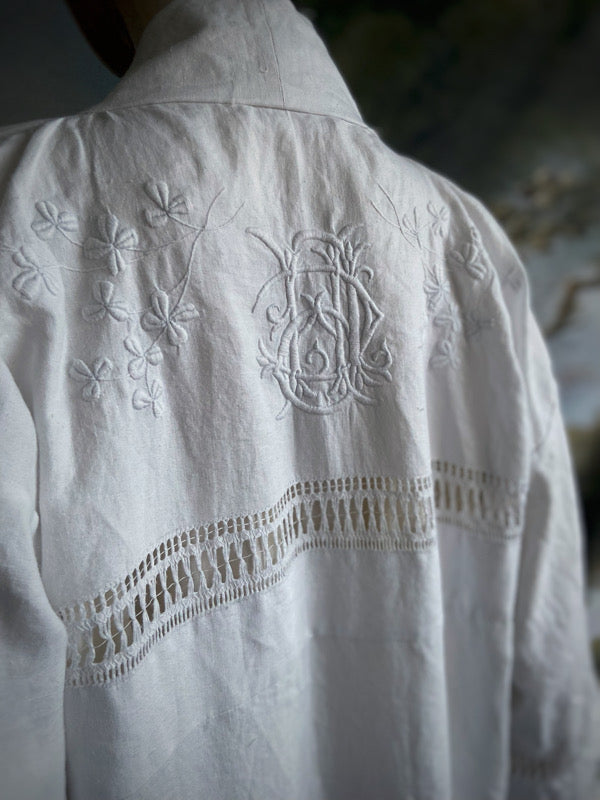 Full length kimono inspired robe with large patch pockets and wide sleeves. Created from an antique Irish linen monogrammed sheet with hand embroidered clover leaves, lace and drawn thread work. All French seamed with hand finished hems and collar. Bohemian styles sustainably created from antique and vintage textiles by the Pavilion Parade studio.