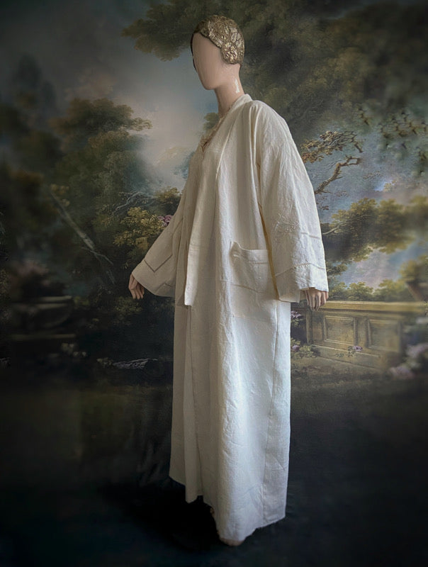 Full length kimono inspired robe with large patch pockets and wide sleeves. Created from an antique heavy French linen monogrammed trousseau sheet with hand embroidered butterflies and drawn thread work. All French seamed with hand finished hems and collar. Bohemian styles sustainably created from antique and vintage textiles by the Pavilion Parade studio.