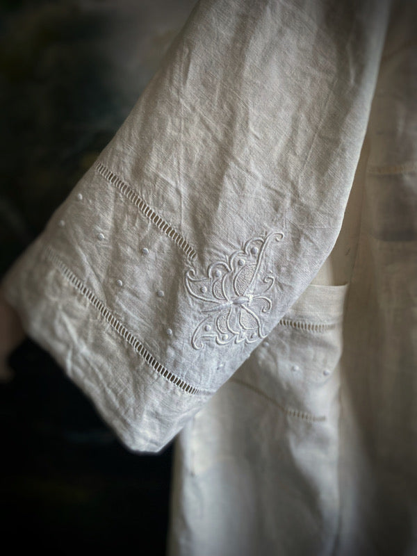 Full length kimono inspired robe with large patch pockets and wide sleeves. Created from an antique heavy French linen monogrammed trousseau sheet with hand embroidered butterflies and drawn thread work. All French seamed with hand finished hems and collar. Bohemian styles sustainably created from antique and vintage textiles by the Pavilion Parade studio.