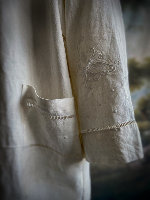 Full length kimono inspired robe with large patch pockets and wide sleeves. Created from an antique heavy French linen monogrammed trousseau sheet with hand embroidered butterflies and drawn thread work. All French seamed with hand finished hems and collar. Bohemian styles sustainably created from antique and vintage textiles by the Pavilion Parade studio.