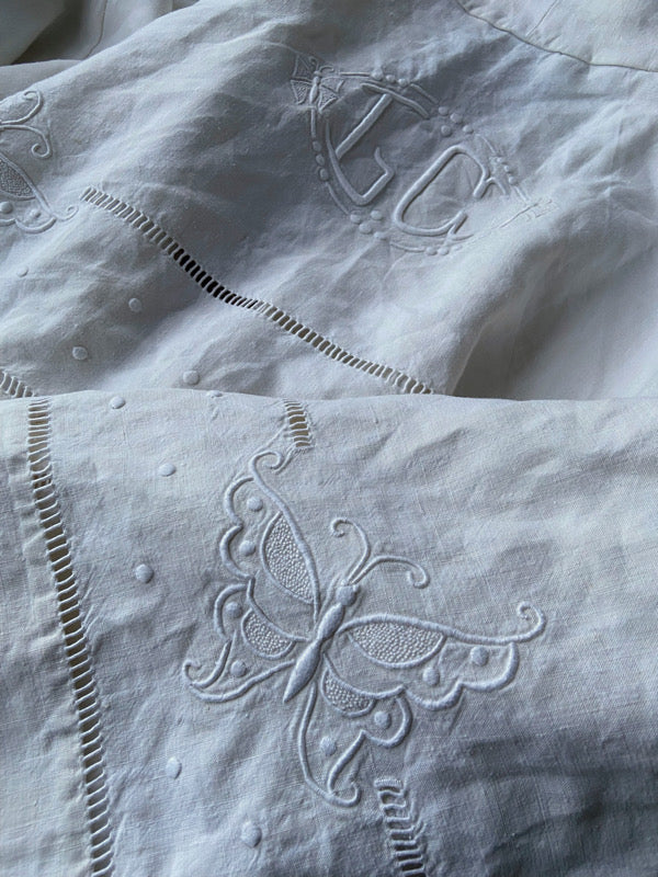 Full length kimono inspired robe with large patch pockets and wide sleeves. Created from an antique heavy French linen monogrammed trousseau sheet with hand embroidered butterflies and drawn thread work. All French seamed with hand finished hems and collar. Bohemian styles sustainably created from antique and vintage textiles by the Pavilion Parade studio.