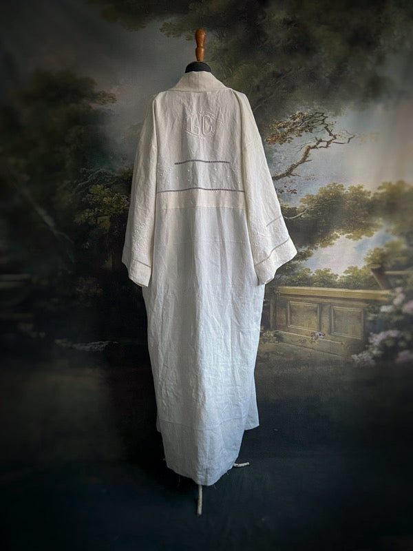 Full length kimono inspired robe with large patch pockets and wide sleeves. Created from an antique heavy French linen monogrammed trousseau sheet with hand embroidered butterflies and drawn thread work. All French seamed with hand finished hems and collar. Bohemian styles sustainably created from antique and vintage textiles by the Pavilion Parade studio.