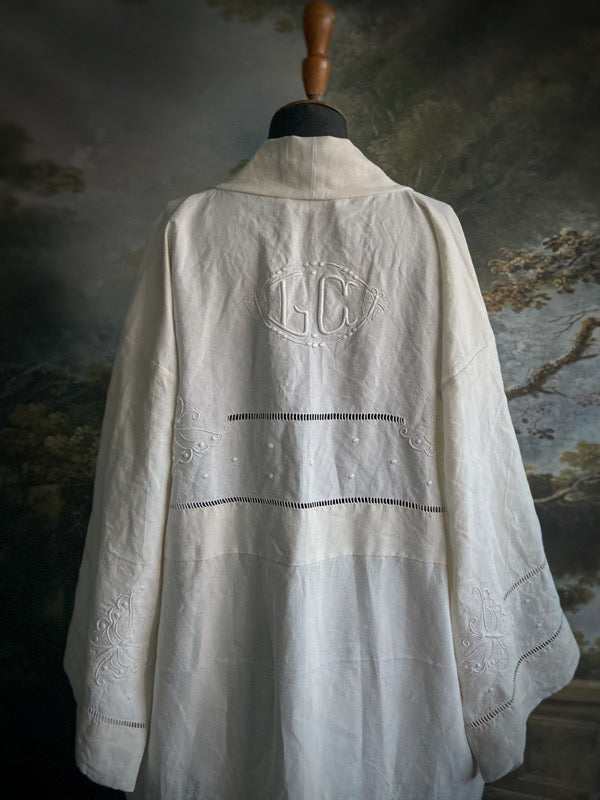 Full length kimono inspired robe with large patch pockets and wide sleeves. Created from an antique heavy French linen monogrammed trousseau sheet with hand embroidered butterflies and drawn thread work. All French seamed with hand finished hems and collar. Bohemian styles sustainably created from antique and vintage textiles by the Pavilion Parade studio.