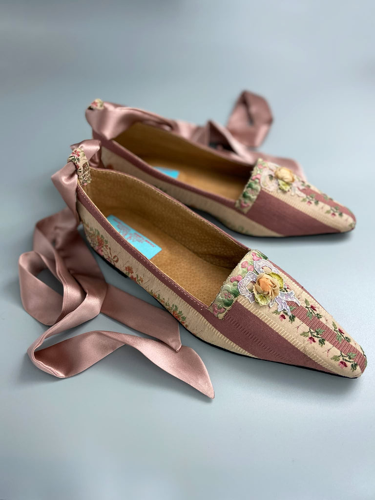 Rosebud toile pointed toe Regency dancing slippers with antique silk appliqué bows and ankle ribbons. Bohemian style created from antique and vintage textiles by Pavilion Parade.