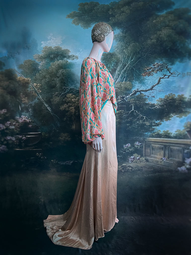 Rose pink and turquoise silk georgette Calla lily printed blouse with long full sleeves and adjustable drawstring neckline. Bohemian styles sustainably created from antique and vintage textiles by the Pavilion Parade studio. 