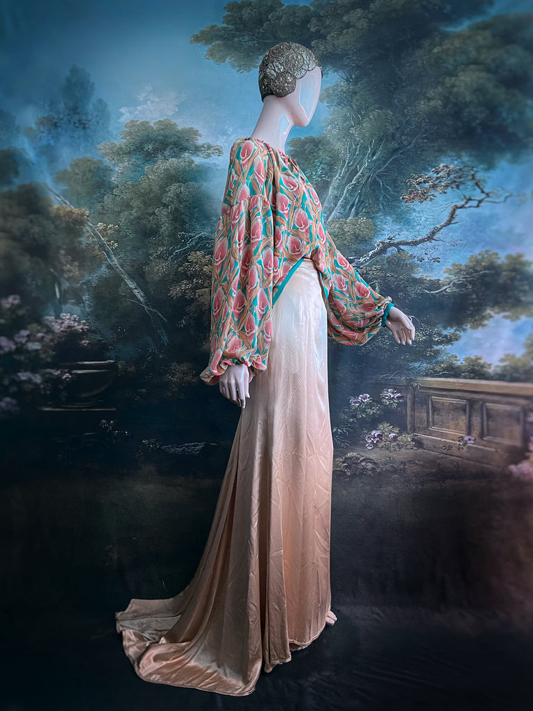 Rose pink and turquoise silk georgette Calla lily printed blouse with long full sleeves and adjustable drawstring neckline. Bohemian styles sustainably created from antique and vintage textiles by the Pavilion Parade studio. 