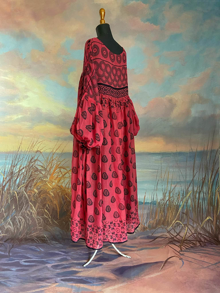 Vibrant pink and black block printed fine cotton muslin volume dress.  Balloon sleeves, ankle length, with pockets. Unique bohemian garments sustainably created from antique and vintage textiles by the Pavilion Parade studio.