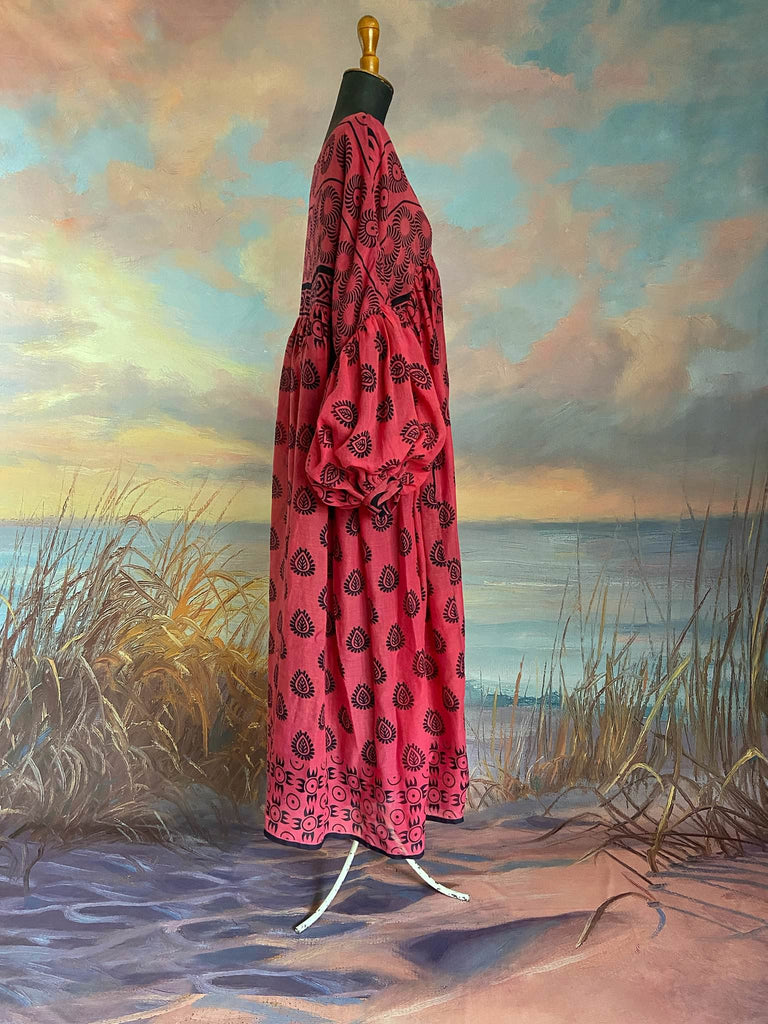 Vibrant pink and black block printed fine cotton muslin volume dress.  Balloon sleeves, ankle length, with pockets. Unique bohemian garments sustainably created from antique and vintage textiles by the Pavilion Parade studio.