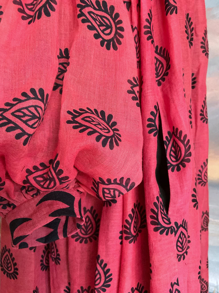 Vibrant pink and black block printed fine cotton muslin volume dress.  Balloon sleeves, ankle length, with pockets. Unique bohemian garments sustainably created from antique and vintage textiles by the Pavilion Parade studio.