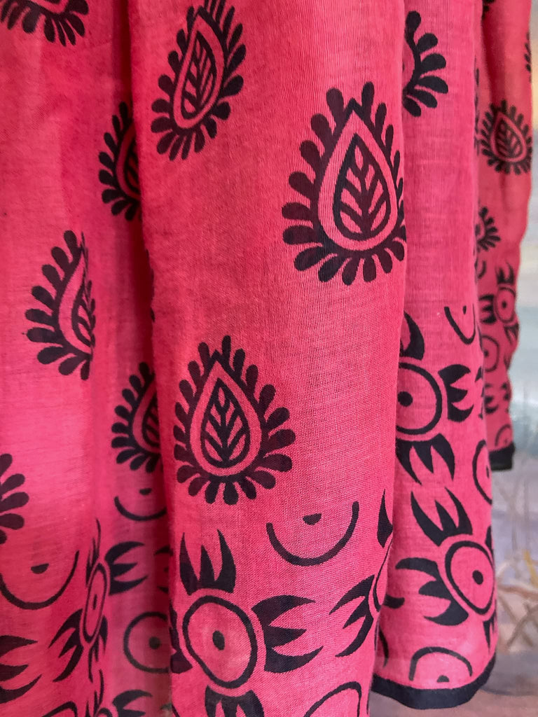 Vibrant pink and black block printed fine cotton muslin volume dress.  Balloon sleeves, ankle length, with pockets. Unique bohemian garments sustainably created from antique and vintage textiles by the Pavilion Parade studio.