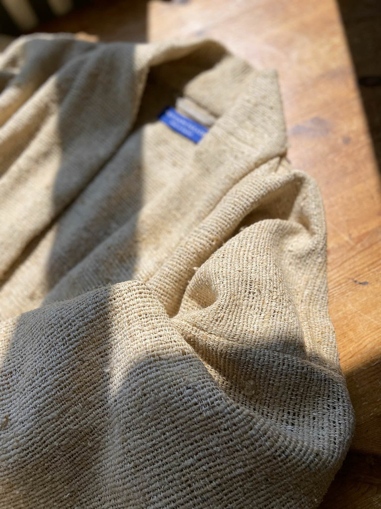 Full length kimono inspired robe with large patch pockets. Newly created from a bolt end of vintage raw silk with the colour and texture of antique hemp grain sacks. All French seamed with hand finished hems and collar. Bohemian styles sustainably created from antique and vintage textiles by the Pavilion Parade studio.