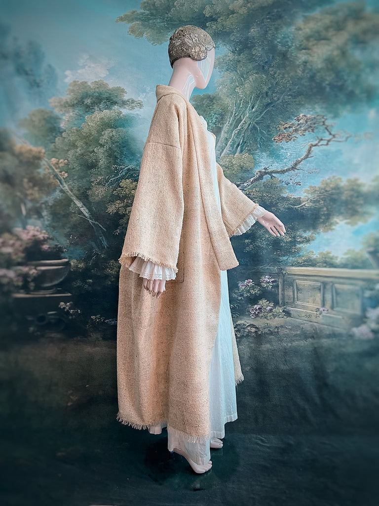 Full length kimono inspired robe with large patch pockets. Newly created from a bolt end of vintage raw silk with the colour and texture of antique hemp grain sacks. All French seamed with hand finished hems and collar. Bohemian styles sustainably created from antique and vintage textiles by the Pavilion Parade studio.