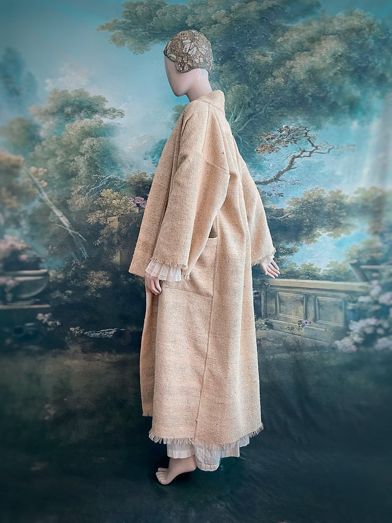 Full length kimono inspired robe with large patch pockets. Newly created from a bolt end of vintage raw silk with the colour and texture of antique hemp grain sacks. All French seamed with hand finished hems and collar. Bohemian styles sustainably created from antique and vintage textiles by the Pavilion Parade studio.