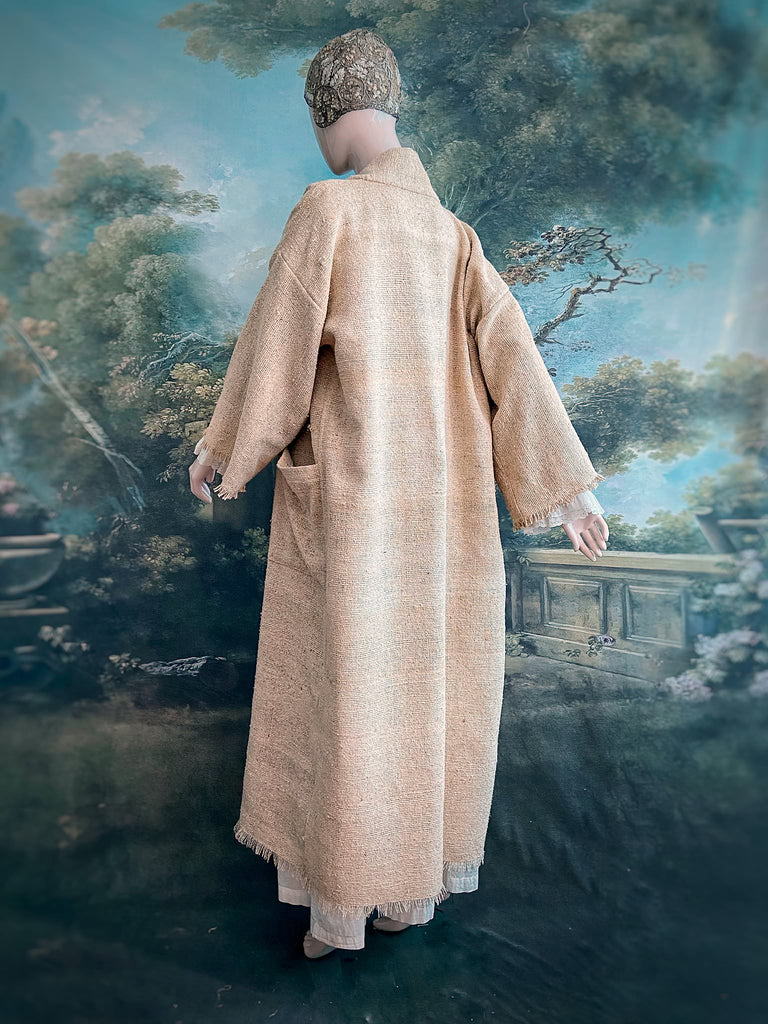 Full length kimono inspired robe with large patch pockets. Newly created from a bolt end of vintage raw silk with the colour and texture of antique hemp grain sacks. All French seamed with hand finished hems and collar. Bohemian styles sustainably created from antique and vintage textiles by the Pavilion Parade studio.